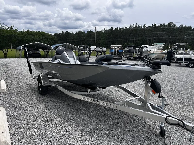 Slide: The Image of 2026 Xpress H17 boat on trailer, gray color, displayed outdoors. - 3