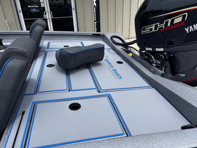 Slide: The Image of 2026 Xpress H17 boat with Yamaha engine, gray and blue upholstery. - 6