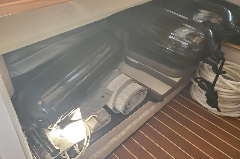 Slide: The Image of Storage compartment in 2024 Cutwater C-30 CB boat with fenders and ropes. - 19