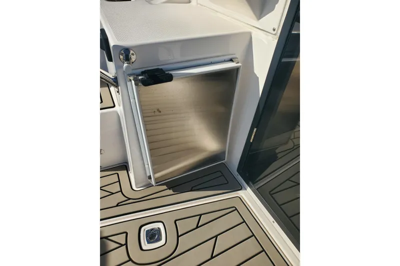 Slide: The Image of 2024 Cutwater C-30 CB boat interior with open stainless steel refrigerator. - 27