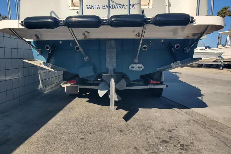 Slide: The Image of 2024 Cutwater C-30 CB boat stern view with propeller and trim tabs in Santa Barbara. - 39