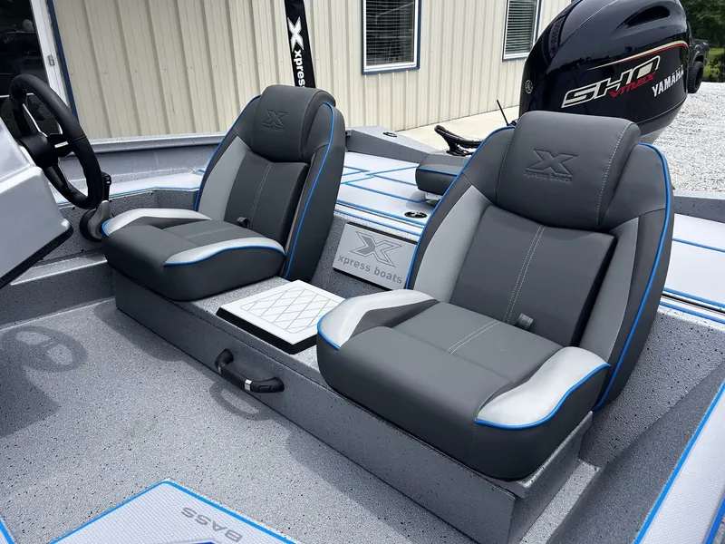 Slide: The Image of Interior of 2026 Xpress H17 boat with gray seats. - 4