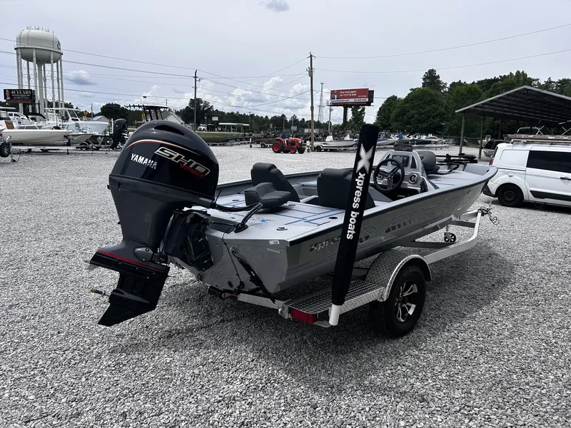 Slide: The Image of 2026 Xpress H17 boat with Yamaha engine on trailer. - 8