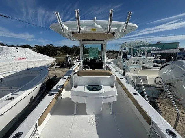 Slide: The Image of Everglades 253 Center Console 2025 on a sunny boat dock. - 49