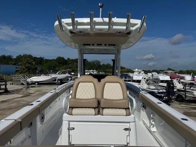 Slide: The Image of 2026 Everglades 285 Center Console boat at a dock. - 42