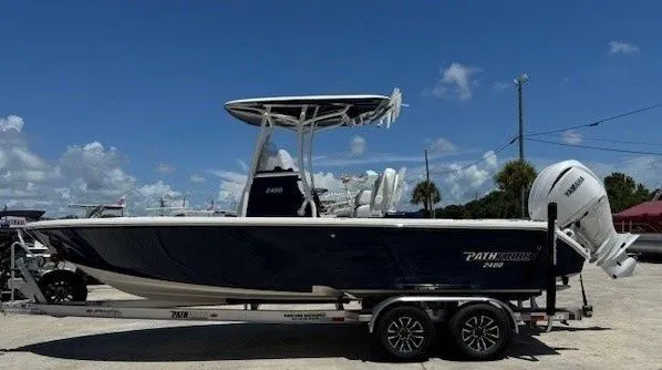 Slide: The Image of Pathfinder 2400 Open 2025 boat on trailer, side view. - 13