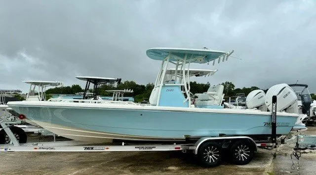 Slide: The Image of 2025 Pathfinder 2600 TRS boat on trailer under cloudy sky. - 17