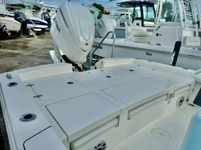 Slide: The Image of Pathfinder 2600 TRS 2025 boat with outboard motors at dock. - 5