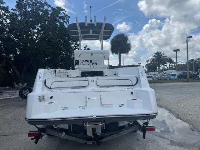 Slide: The Image of Rear view of 2025 Yamaha Boats 222 FSH Sport on a parking lot. - 14