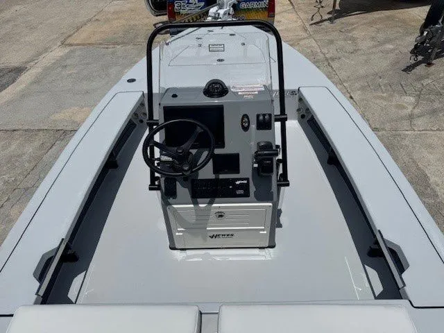 Slide: The Image of 2026 Hewes Redfisher 18 boat cockpit view, steering console and seats. - 22