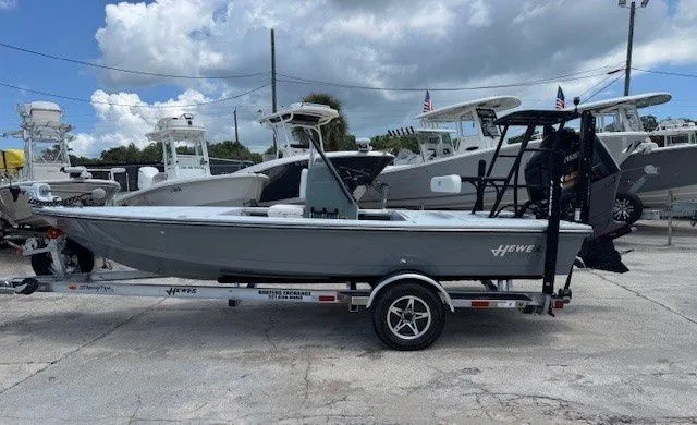 Slide: The Image of 2026 Hewes Redfisher 18 boat on trailer outdoors. - 47