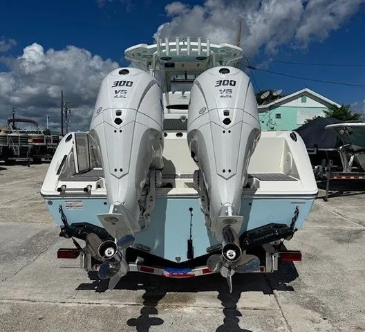 Slide: The Image of 2026 Cobia 305 Center Console with twin 300 HP outboard engines. - 33
