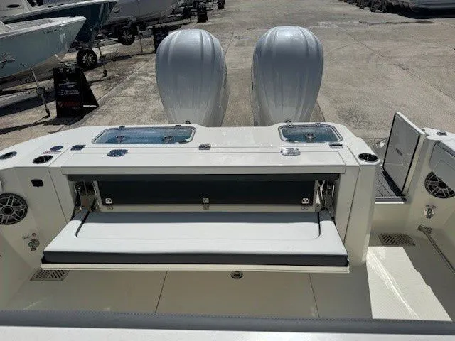 Slide: The Image of Cobia 305 Center Console 2026 with dual outboard engines. - 6