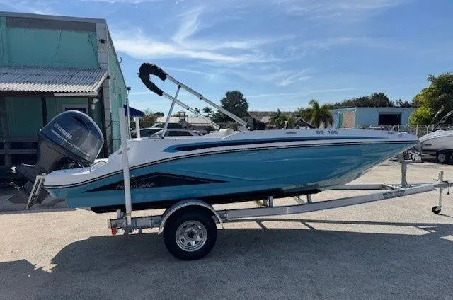 Slide: The Image of 2026 Hurricane SunDeck Sport 185 OB boat on trailer outdoors. - 38