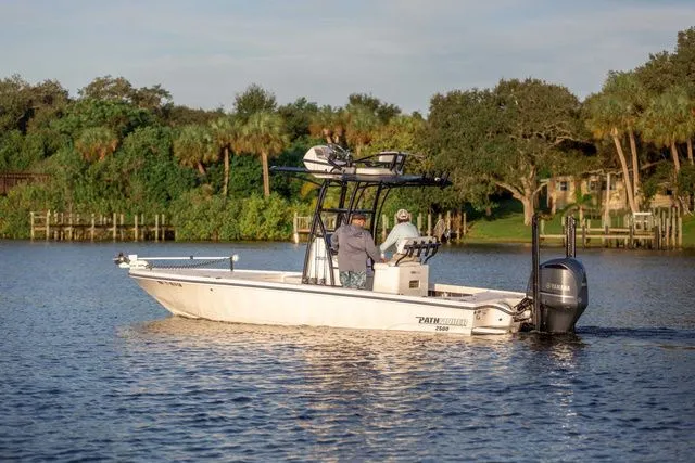 Slide: The Image of 2026 Pathfinder 2500 Hybrid boat on a scenic lake. - 3
