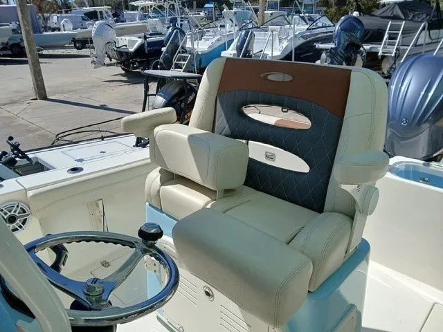 Slide: The Image of 2022 Cobia 240 Center Console boat helm and seating. - 15