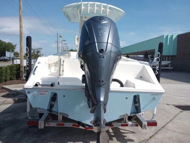 Slide: The Image of 2022 Cobia 240 Center Console boat with outboard motor. - 21