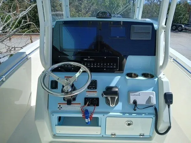 Slide: The Image of Cobia 240 Center Console 2022 helm with modern electronics. - 38