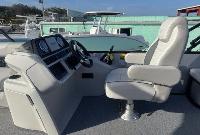 Slide: The Image of Interior of 2026 Sweetwater 2286SFLC with helm console and seat. - 8