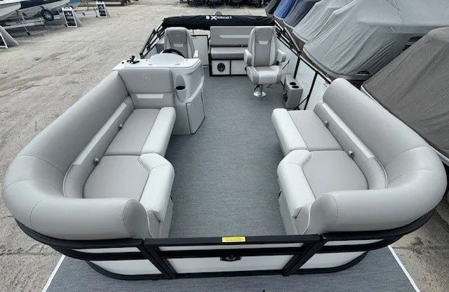 Slide: The Image of Interior view of Sweetwater Xperience 2026 pontoon boat with gray seating. - 34