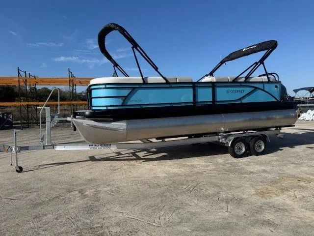 Slide: The Image of 2026 Sweetwater 2286CP pontoon boat on trailer outdoors. - 40