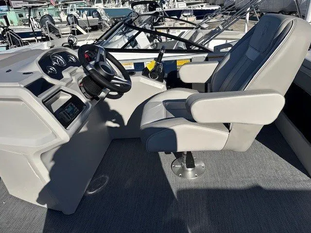 Slide: The Image of Interior of Sweetwater Xperience 2026 with helm console and captain's chair. - 16