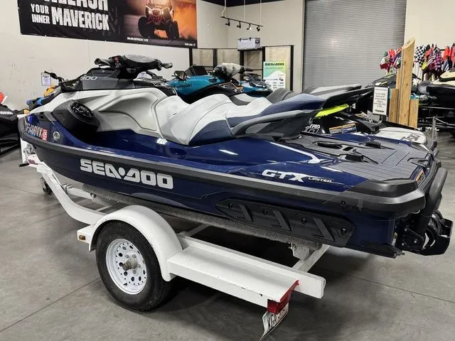Slide: The Image of 2024 Sea-Doo GTX jet ski on trailer in showroom. - 3