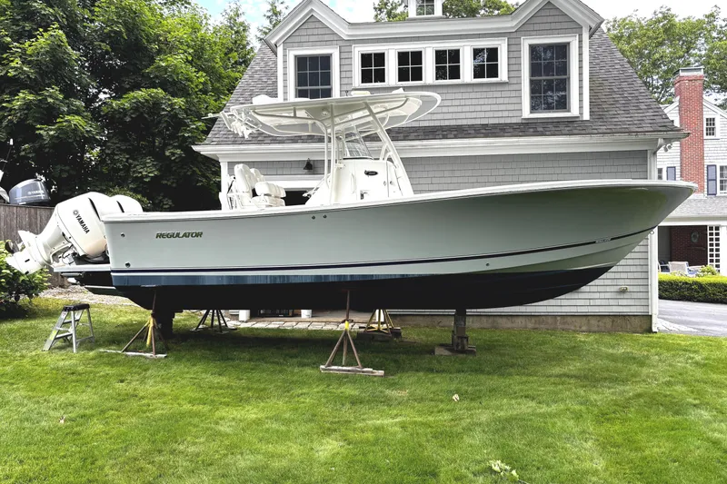 The Image of 2017 Regulator 28 Forward Seating boat on lawn near house. - 0