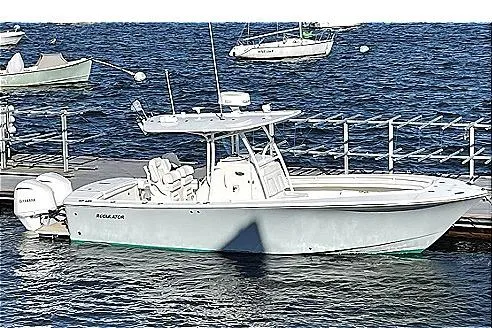 Slide: The Image of 2017 Regulator 28 Forward Seating boat docked on water with Yamaha engines. - 7