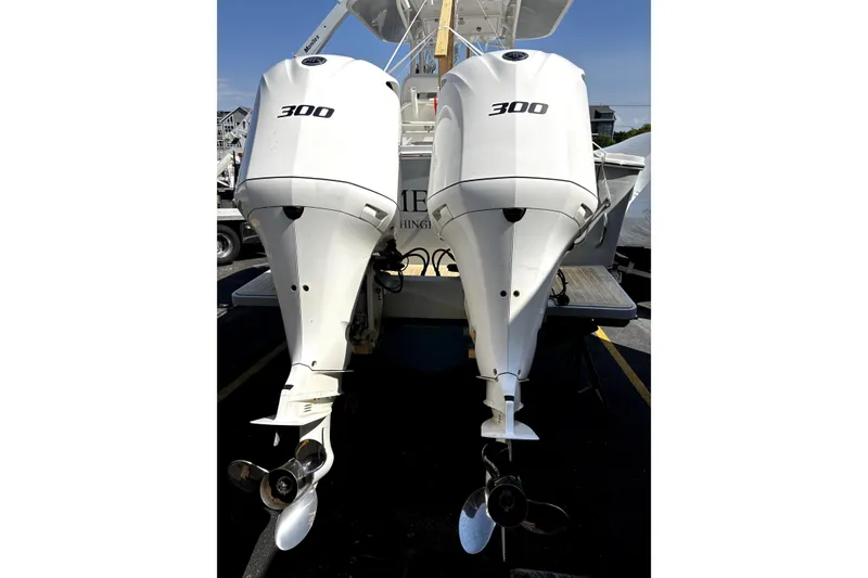Slide: The Image of Twin 300 horsepower engines on a 2017 Regulator 28 Forward Seating boat. - 8