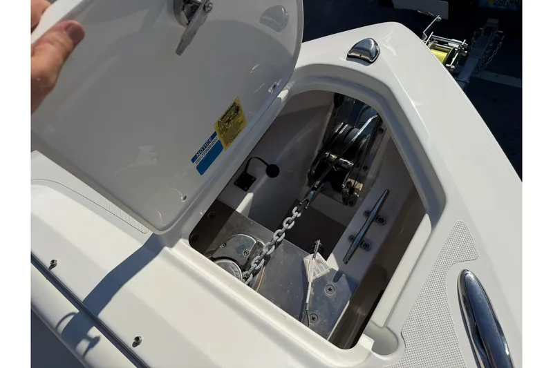 Slide: The Image of Open anchor locker on 2021 Pursuit DC 266 Dual Console boat. - 29