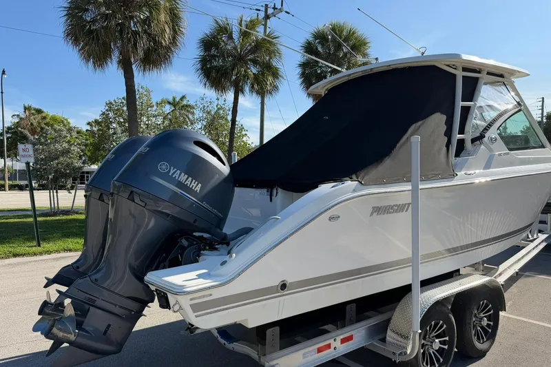 Slide: The Image of 2021 Pursuit DC 266 Dual Console boat with Yamaha outboard engines on a trailer. - 40