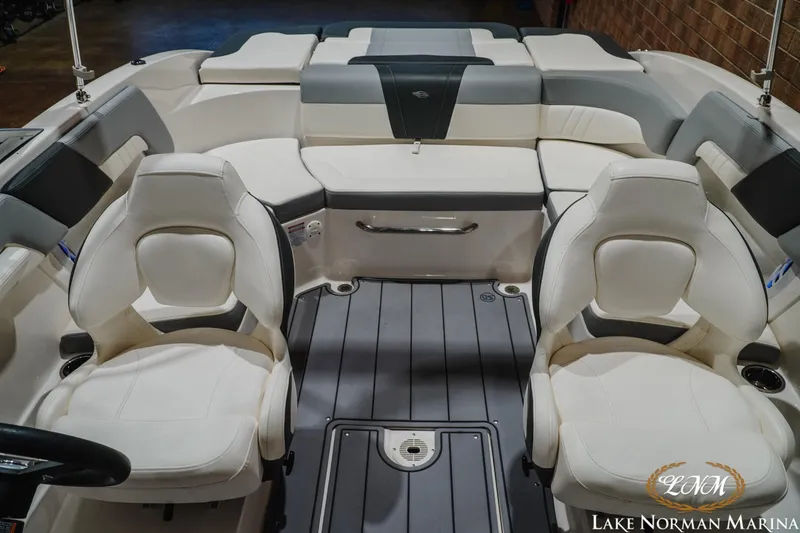 Slide: The Image of 2023 Chaparral 23 SSi boat interior with white seating and modern design. - 18