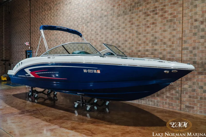 Slide: The Image of 2023 Chaparral 23 SSi boat displayed indoors at Lake Norman Marina. - 3