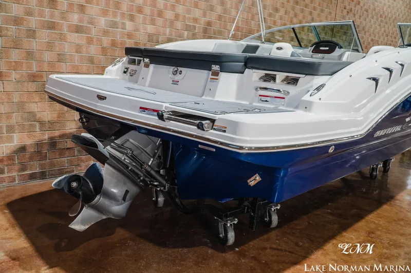 Slide: The Image of 2023 Chaparral 23 SSi boat with sleek design and powerful outboard motor. - 7