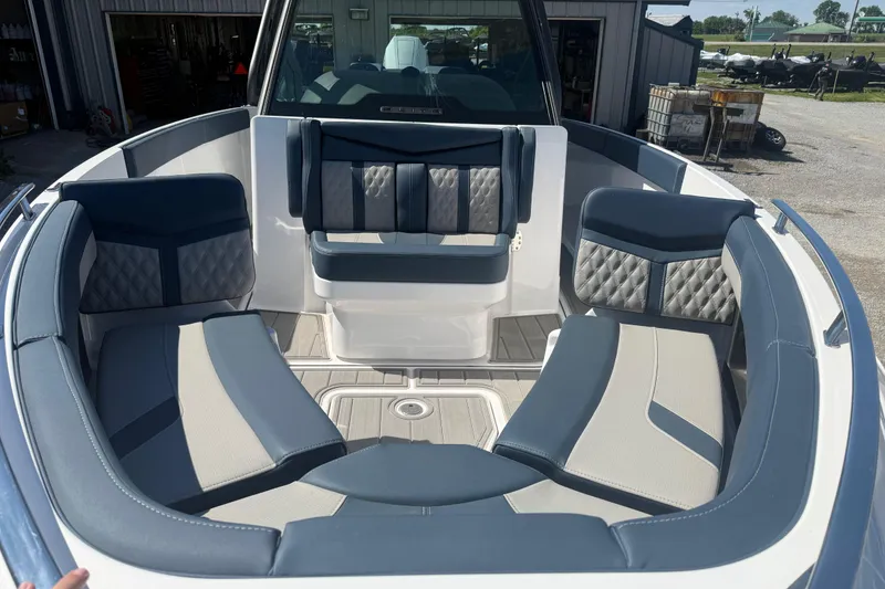 Slide: The Image of Luxurious seating area on the 2025 Monterey Elite 27 OB boat, featuring stylish upholstery. - 10