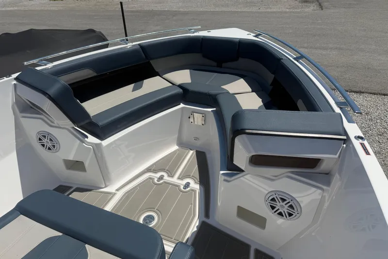 Slide: The Image of 2025 Monterey Elite 27 OB boat interior with cushioned seating and speakers. - 11