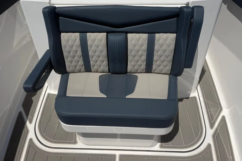 Slide: The Image of Luxury seating on 2025 Monterey Elite 27 OB boat, featuring elegant blue and gray upholstery. - 12