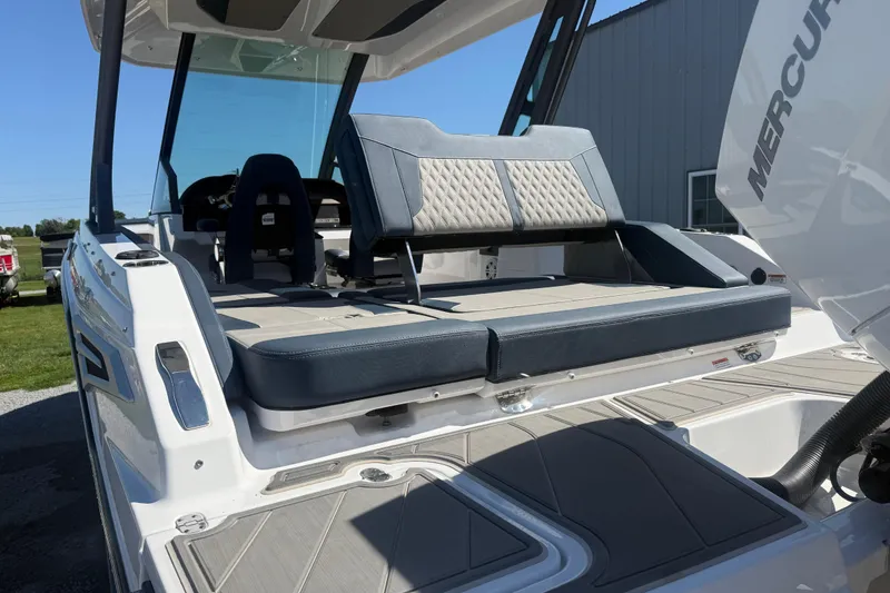 Slide: The Image of 2025 Monterey Elite 27 OB boat with luxurious seating and modern design. - 5