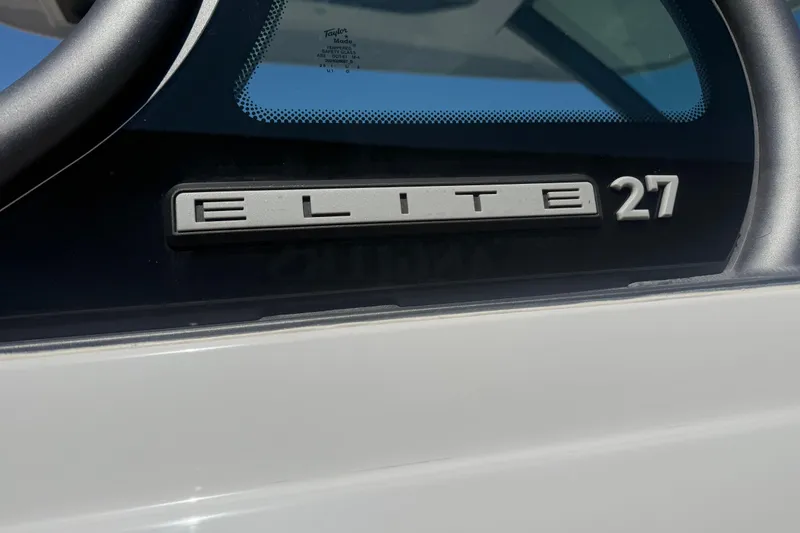 Slide: The Image of 2025 Monterey Elite 27 OB boat emblem close-up. - 7