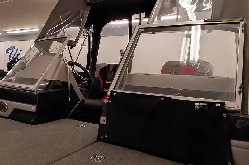 Slide: The Image of 2024 Ranger 621FS Fisherman boat interior with open windshield and steering wheel. - 10