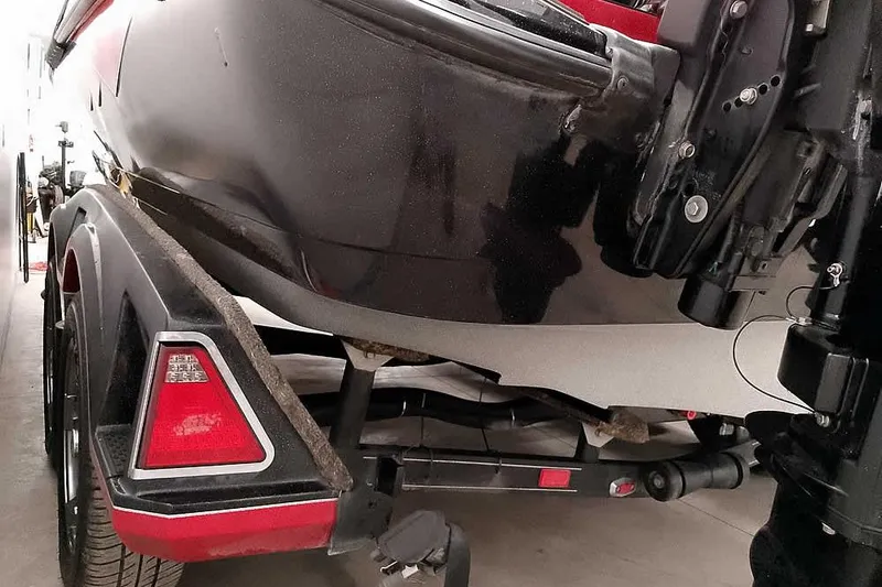 Slide: The Image of 2024 Ranger 621FS Fisherman boat on trailer, rear view in garage setting. - 13