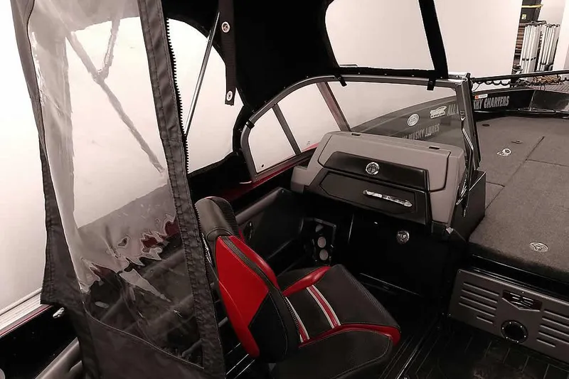 Slide: The Image of 2024 Ranger 621FS Fisherman boat interior with red and black seating and dashboard. - 16