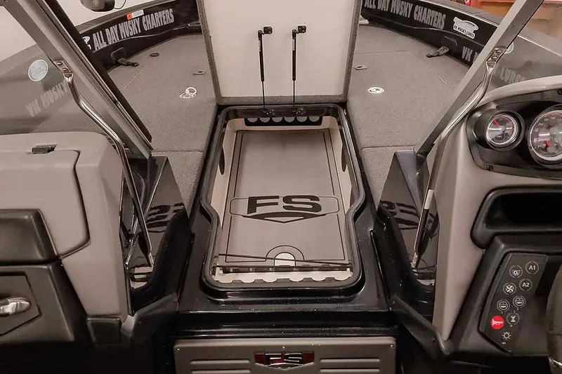 Slide: The Image of 2024 Ranger 621FS Fisherman boat interior with control panel and storage area. - 17