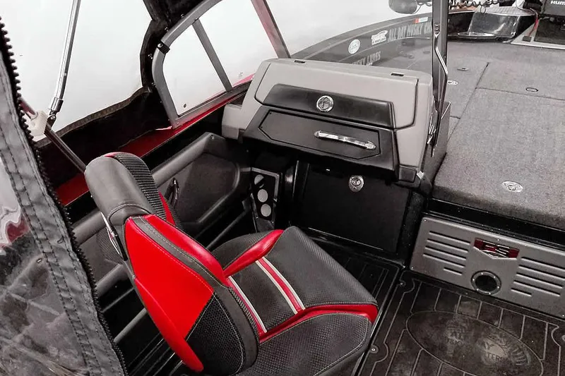 Slide: The Image of 2024 Ranger 621FS Fisherman boat interior with red and black seating and dashboard. - 25