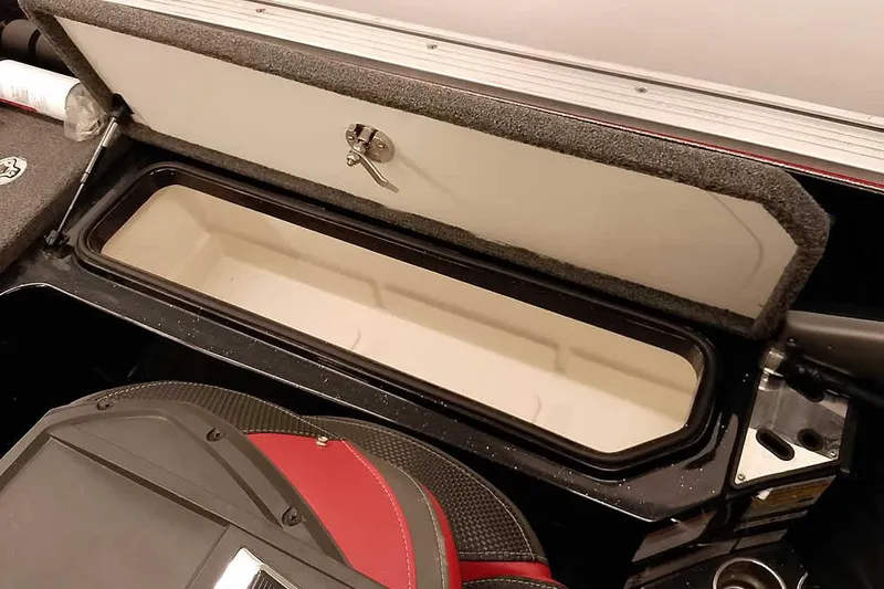 Slide: The Image of 2024 Ranger 621FS Fisherman boat storage compartment with open lid and secure lock. - 36