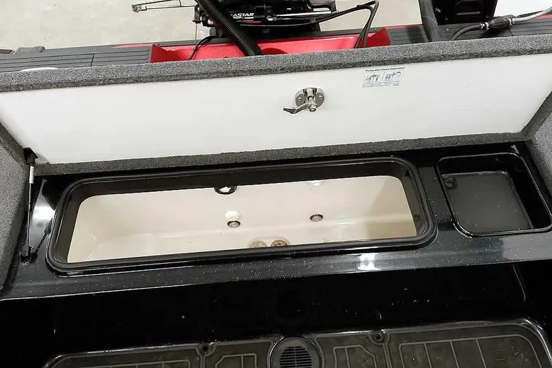 Slide: The Image of 2024 Ranger 621FS Fisherman boat storage compartment with open lid and interior view. - 39