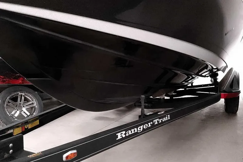 Slide: The Image of 2024 Ranger 621FS Fisherman boat on Ranger Trail trailer, close-up view. - 7