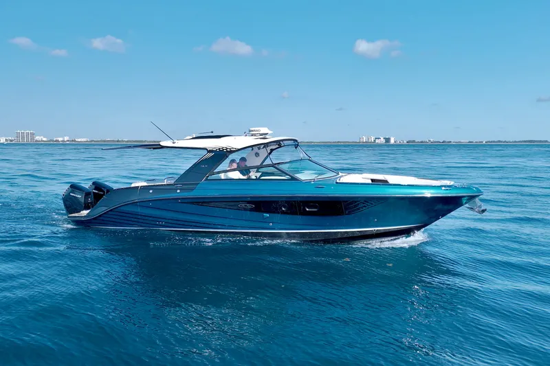 The Image of 2021 Sea Ray SLX 400 Outboard cruising on open blue water. - 0