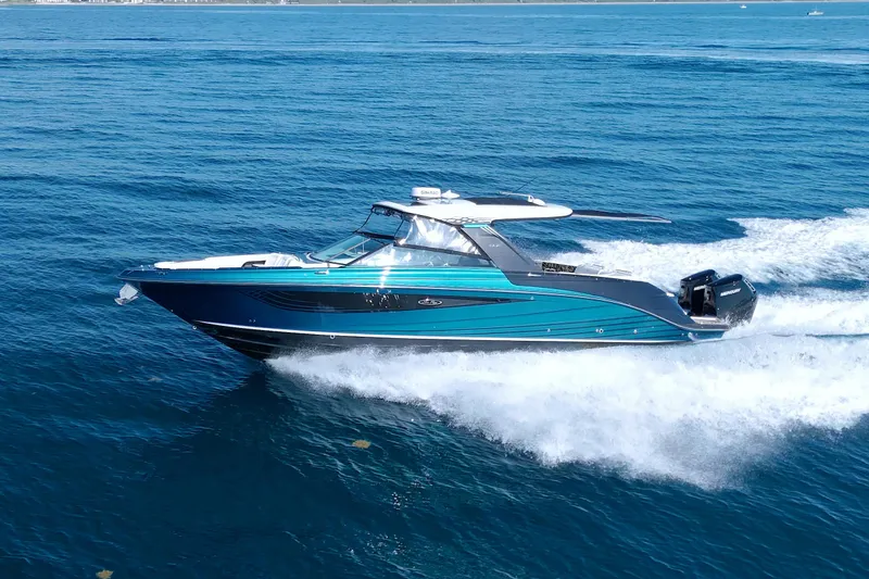 Slide: The Image of 2021 Sea Ray SLX 400 Outboard cruising on open blue water. - 10